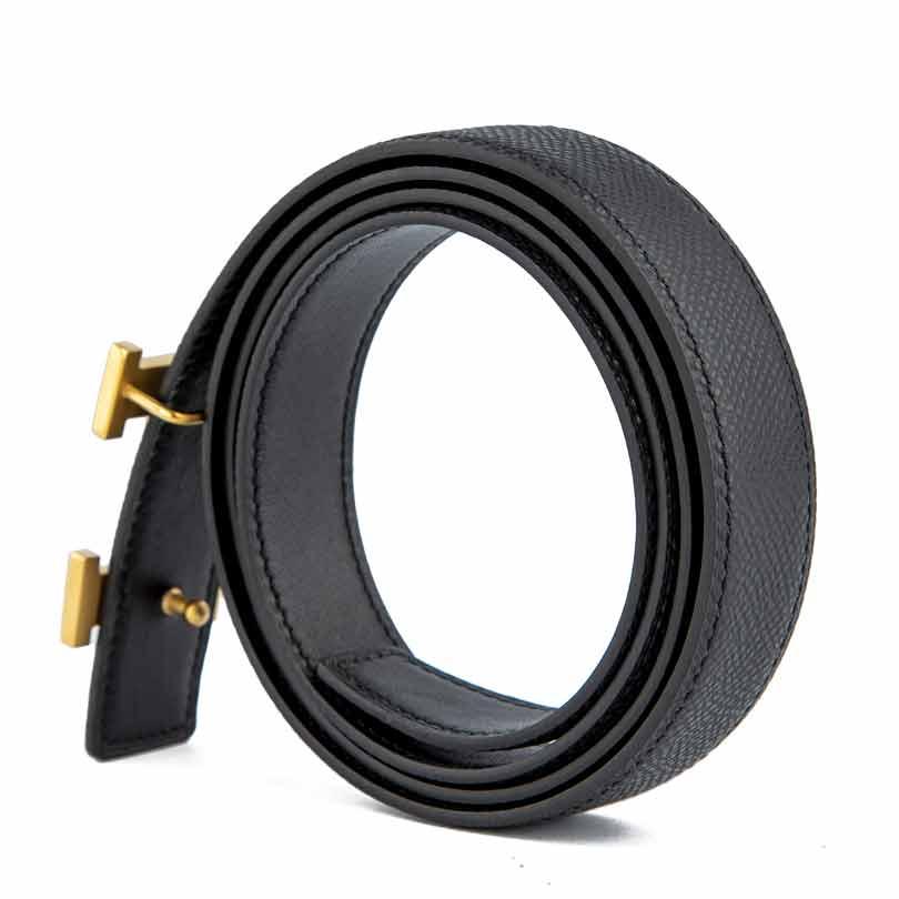 Black leather belt with gold H buckle.