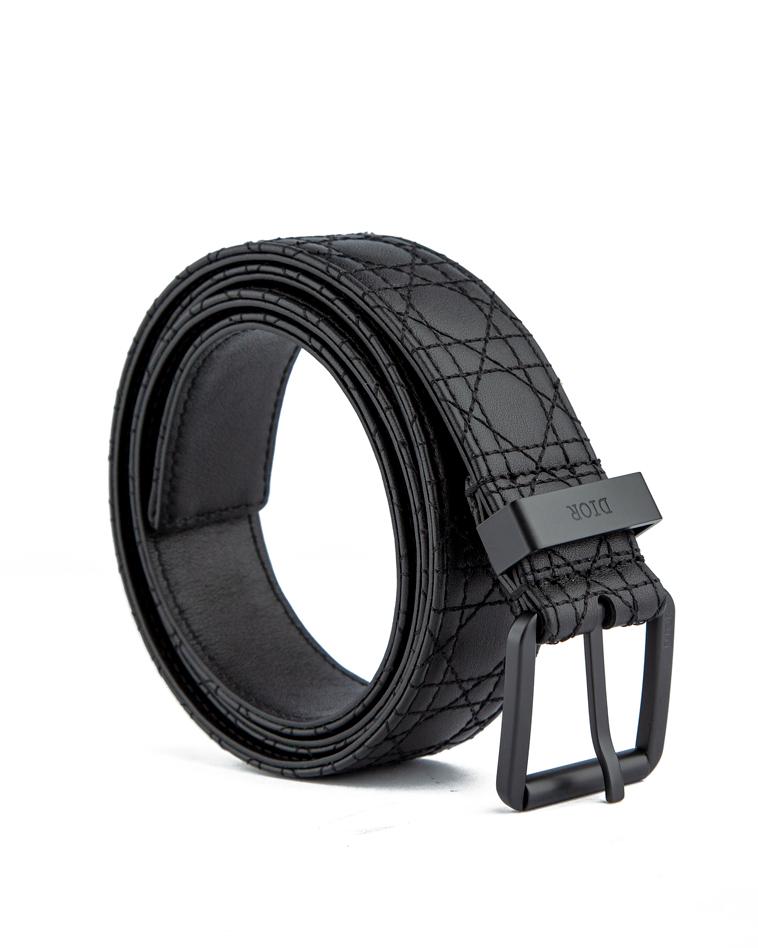 Luxury black quilted leather belt with a sleek matte black buckle, perfect for men and women seeking a refined and sophisticated fashion accessory.