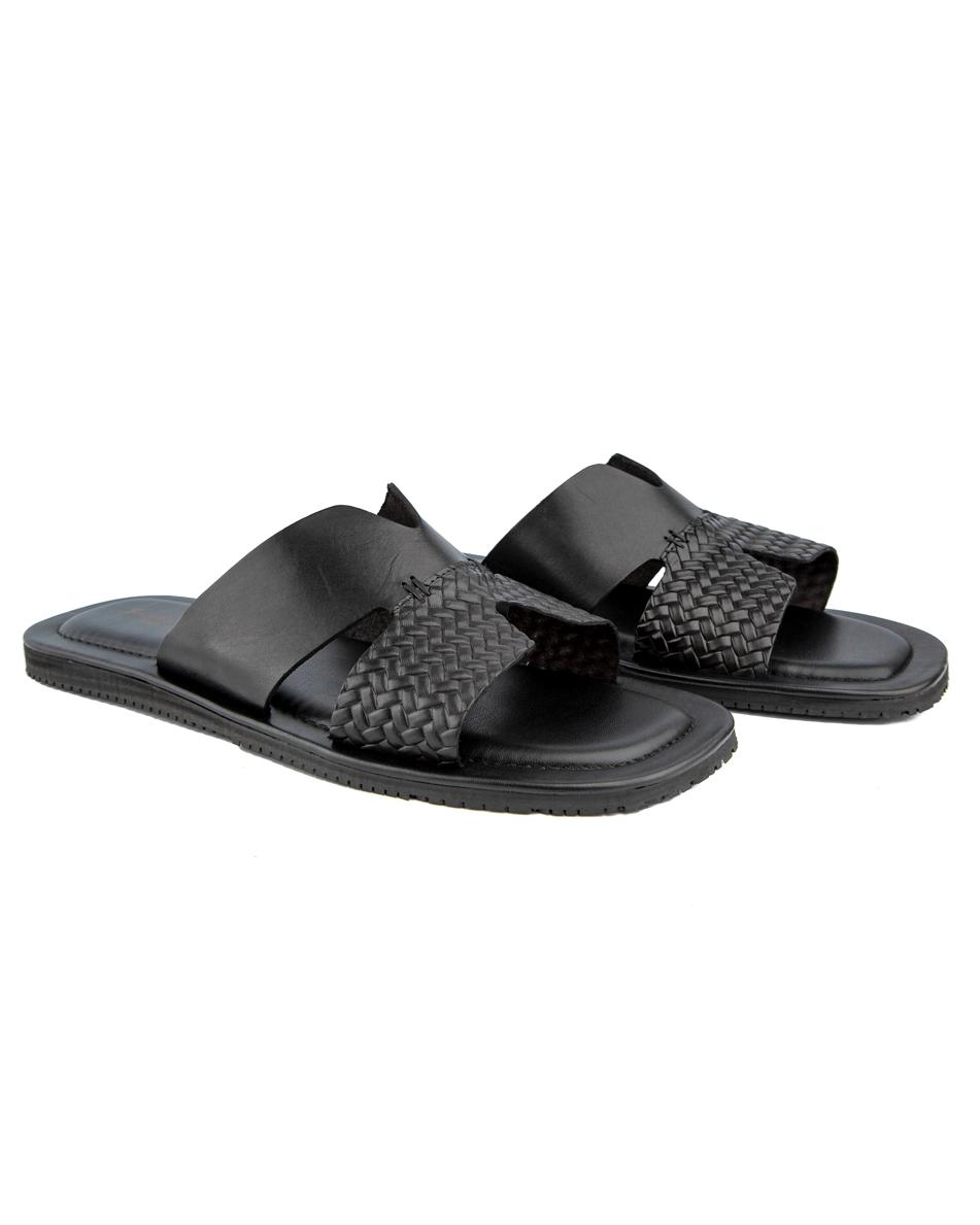 Elegant black woven cross-strap leather sandals with cushioned footbed and durable rubber sole, perfect for casual and semi-formal occasions.