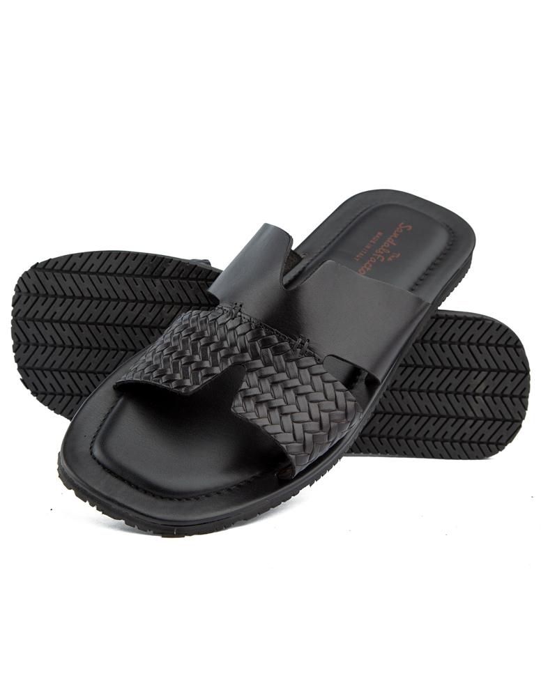 Elegant black woven cross-strap leather sandals with cushioned footbed and durable rubber sole, perfect for casual and semi-formal occasions.