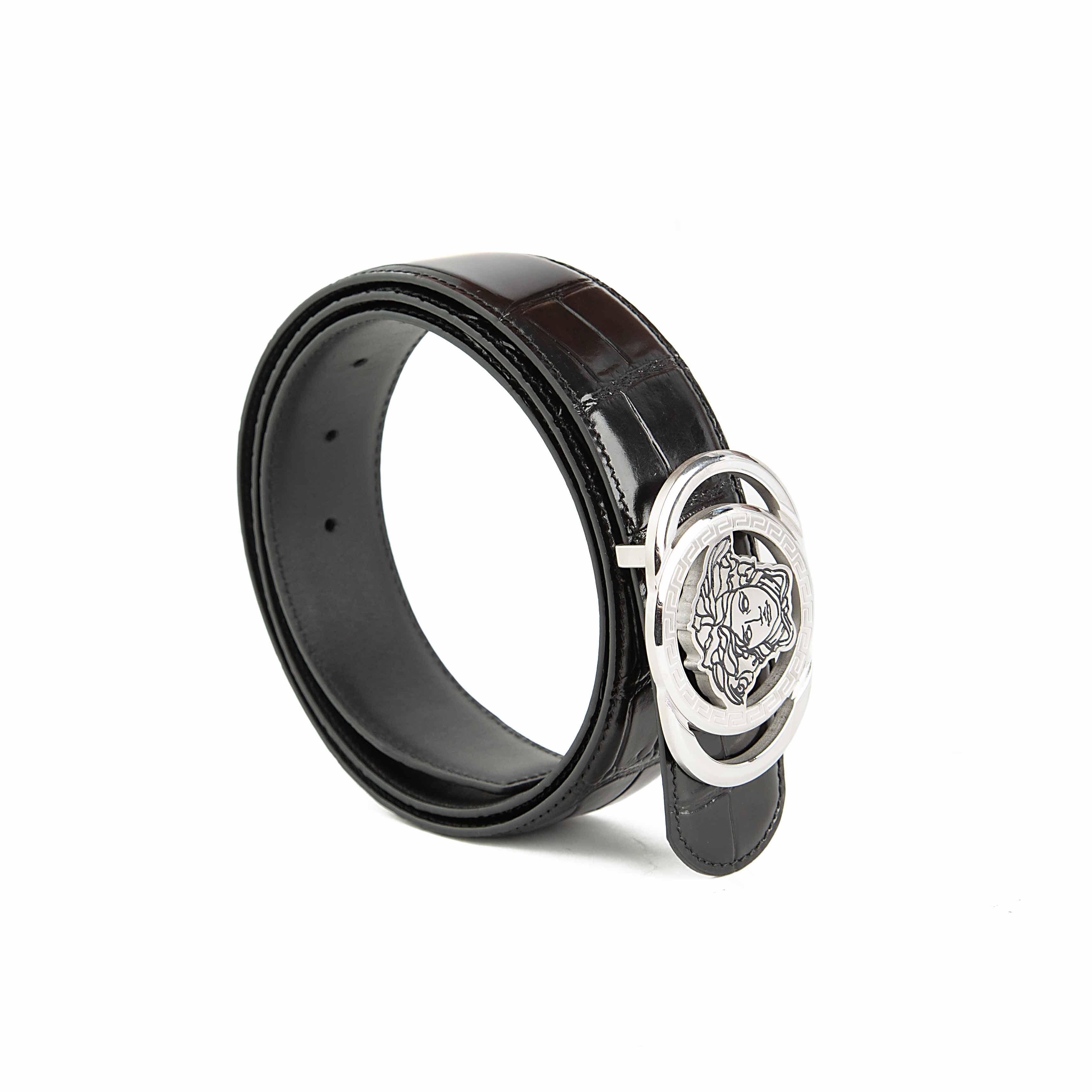 This is a high-fashion, statement Black Leather Belt defined by its bold, colorful design.