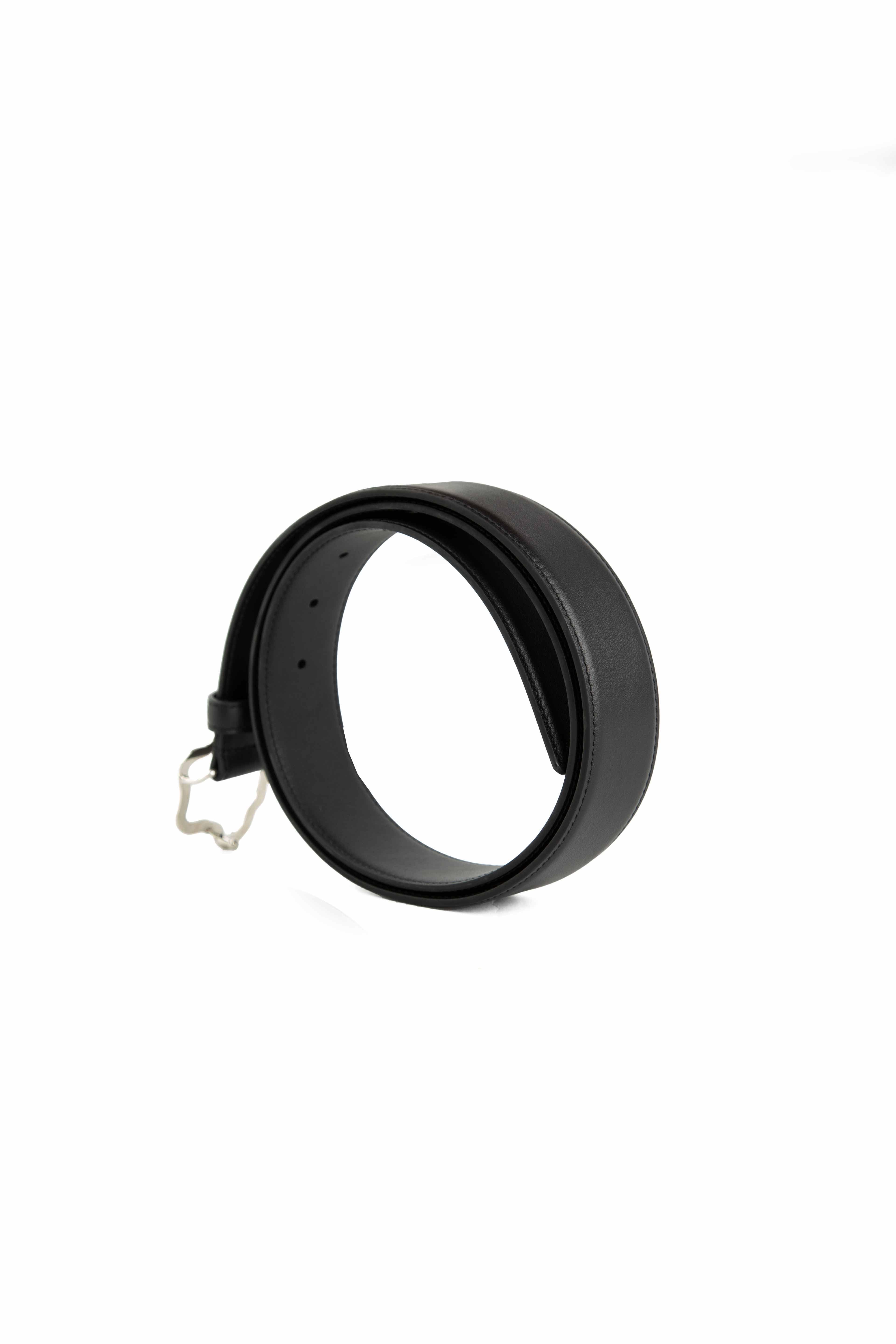 This accessory is a premium Black Leather Belt that makes a bold, luxurious statement.