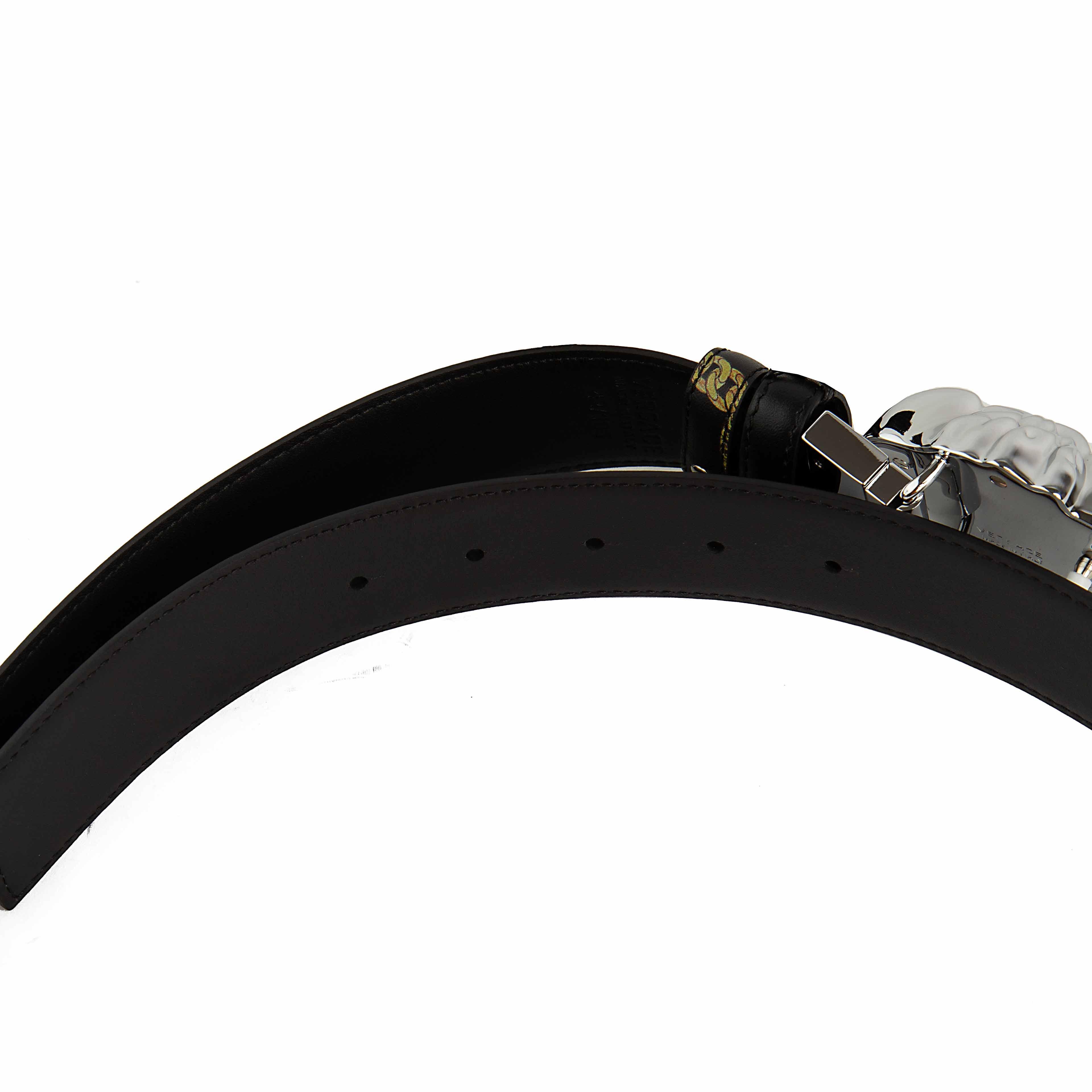 This statement belt is a masterclass in Italian luxury, featuring the legendary 3D Medusa head buckle in a brilliant, polished silver-tone finish.