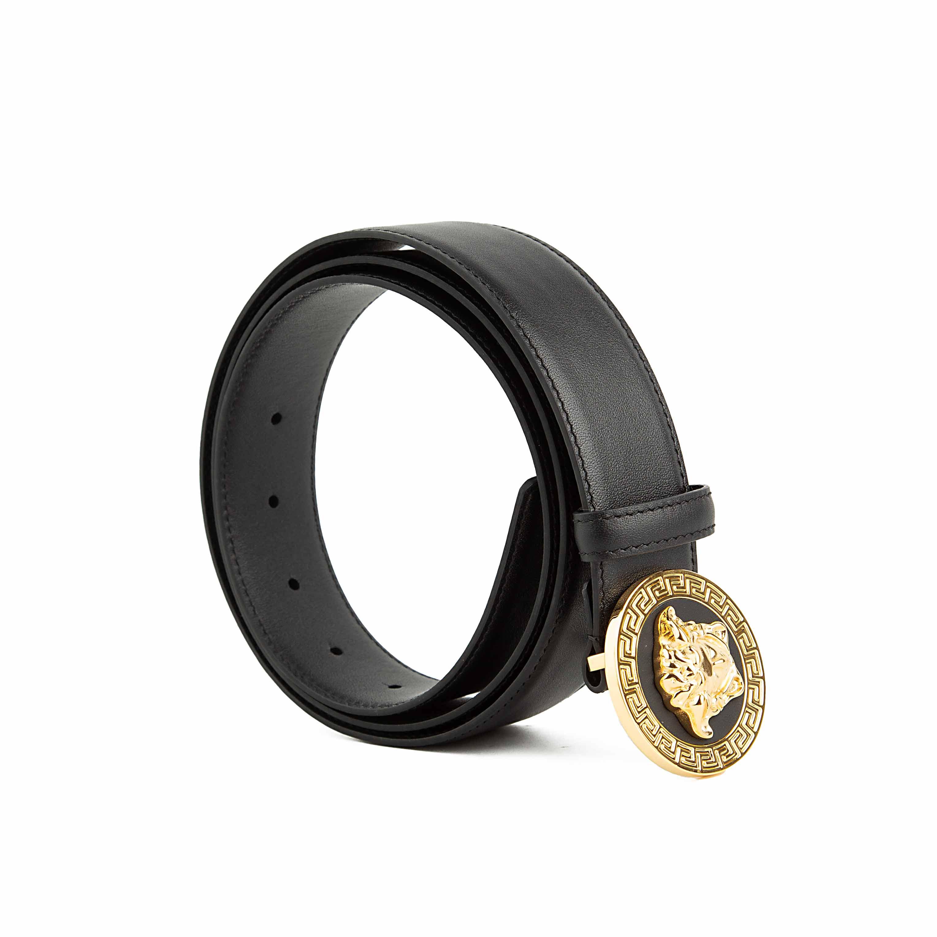 This is a luxurious and instantly recognizable Black Leather Belt defined by its iconic hardware.