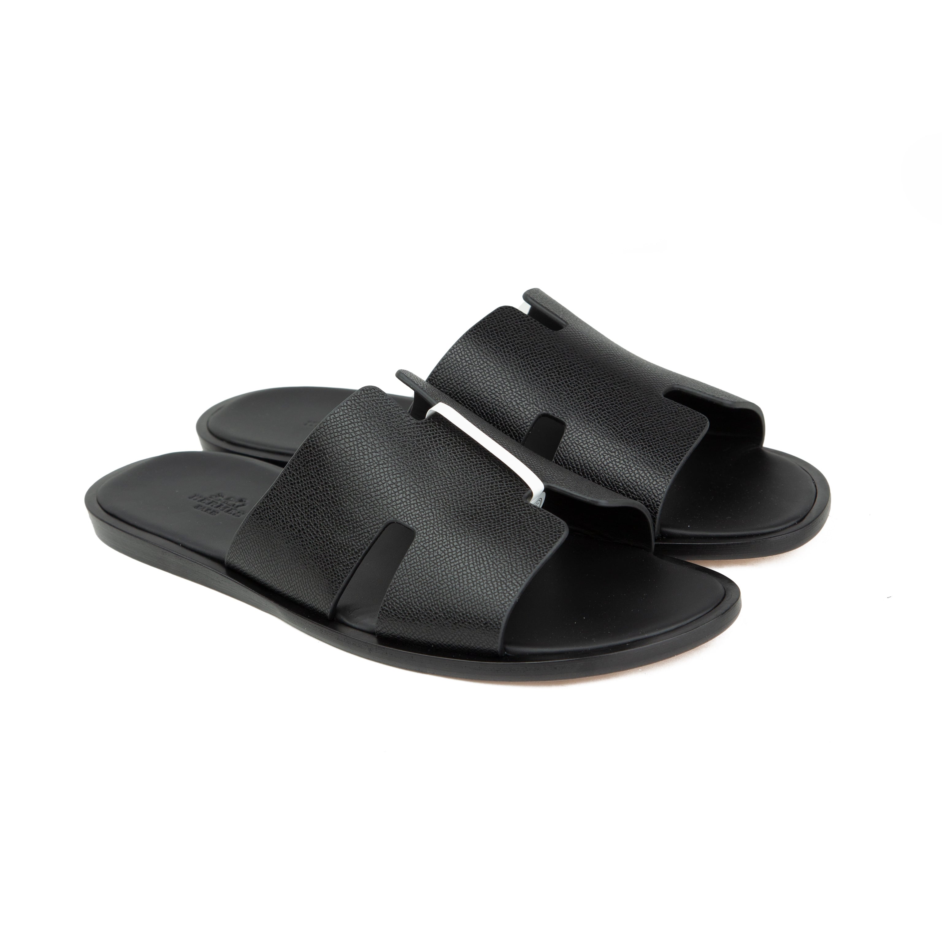 Shop the iconic Hermès Izmir Sandals in Black Epsom leather. Featuring the classic H cut-out design and premium leather soles. Free shipping available.