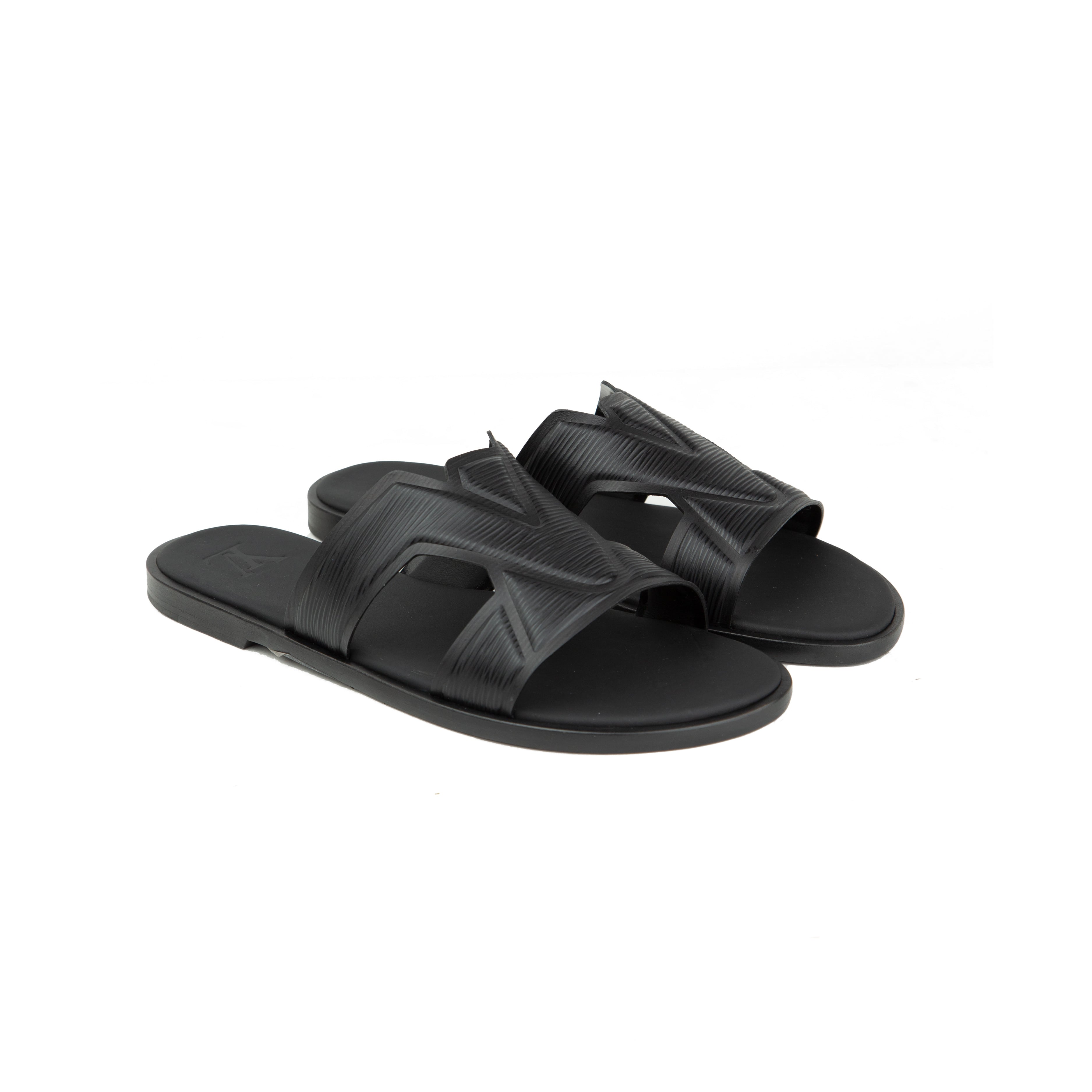 Shop the Louis Vuitton Waterfront Mule in Cognac. Premium grained leather slides featuring an embossed LV logo and ergonomic sole for luxury comfort.