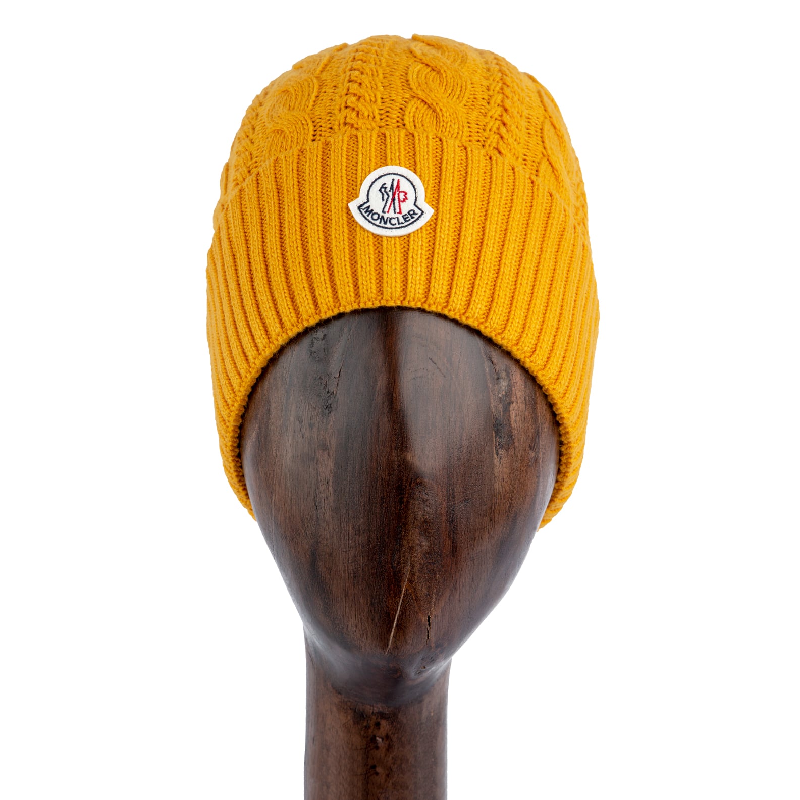 Mustard yellow cable knit wool beanie with logo patch.