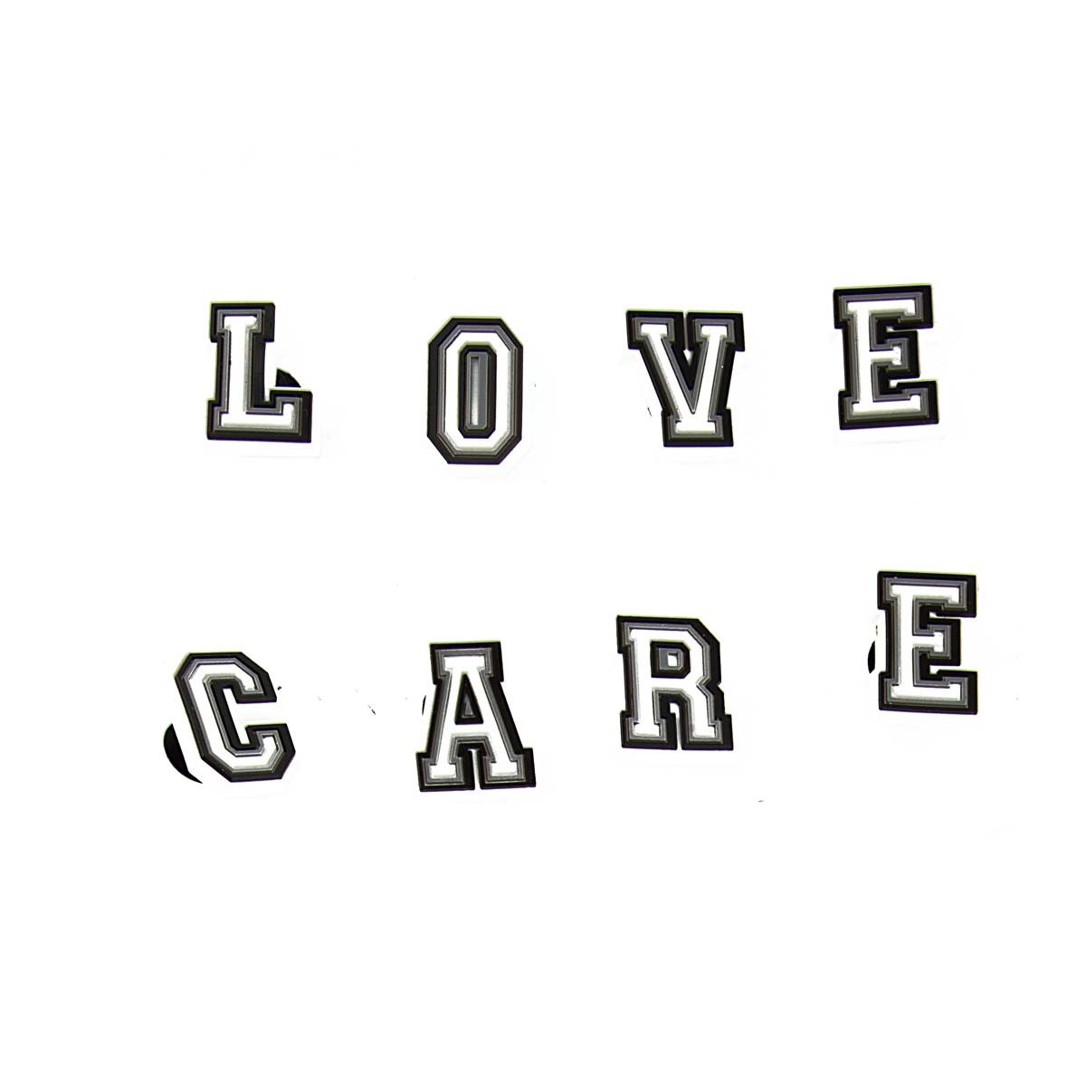 Customize your Crocs with these stylish black & white letter Jibbitz charms. 