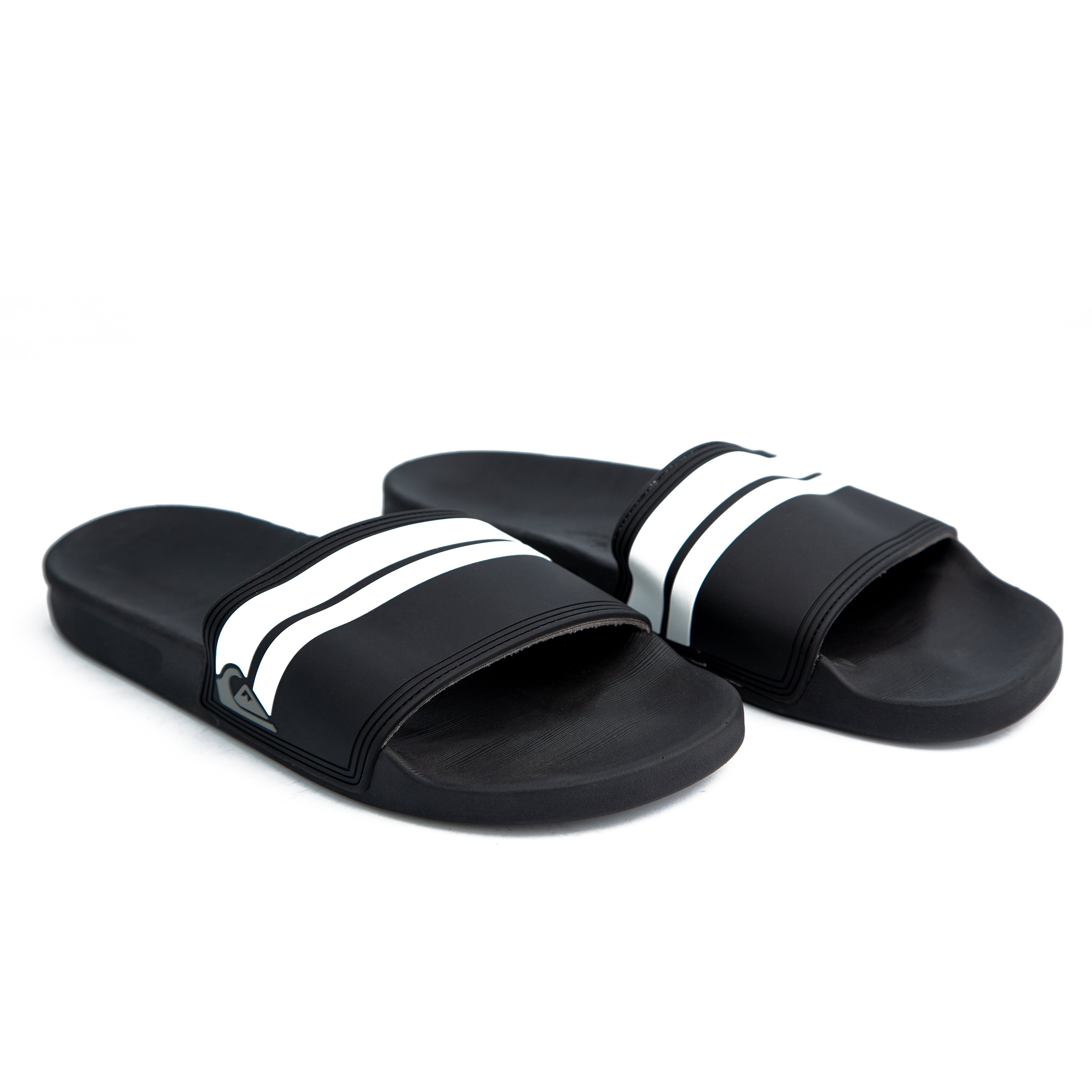 Black Adidas Adilette Comfort Slides with white stripes – stylish, lightweight, and cushioned for ultimate comfort. Perfect for casual and sporty looks.