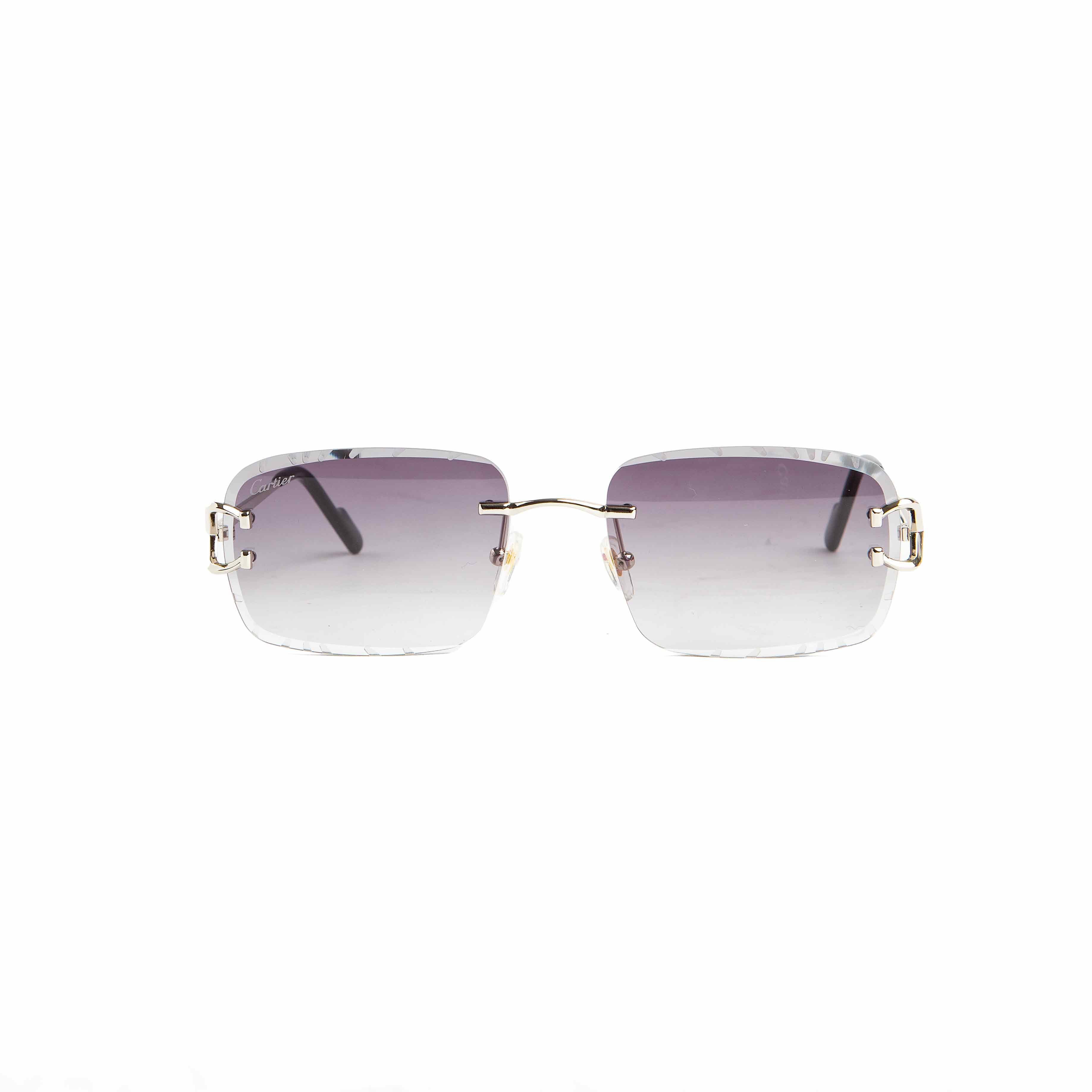 Cartier rimless gradient grey-purple lens sunglasses with gold-tone accents. Luxury eyewear for men and women."