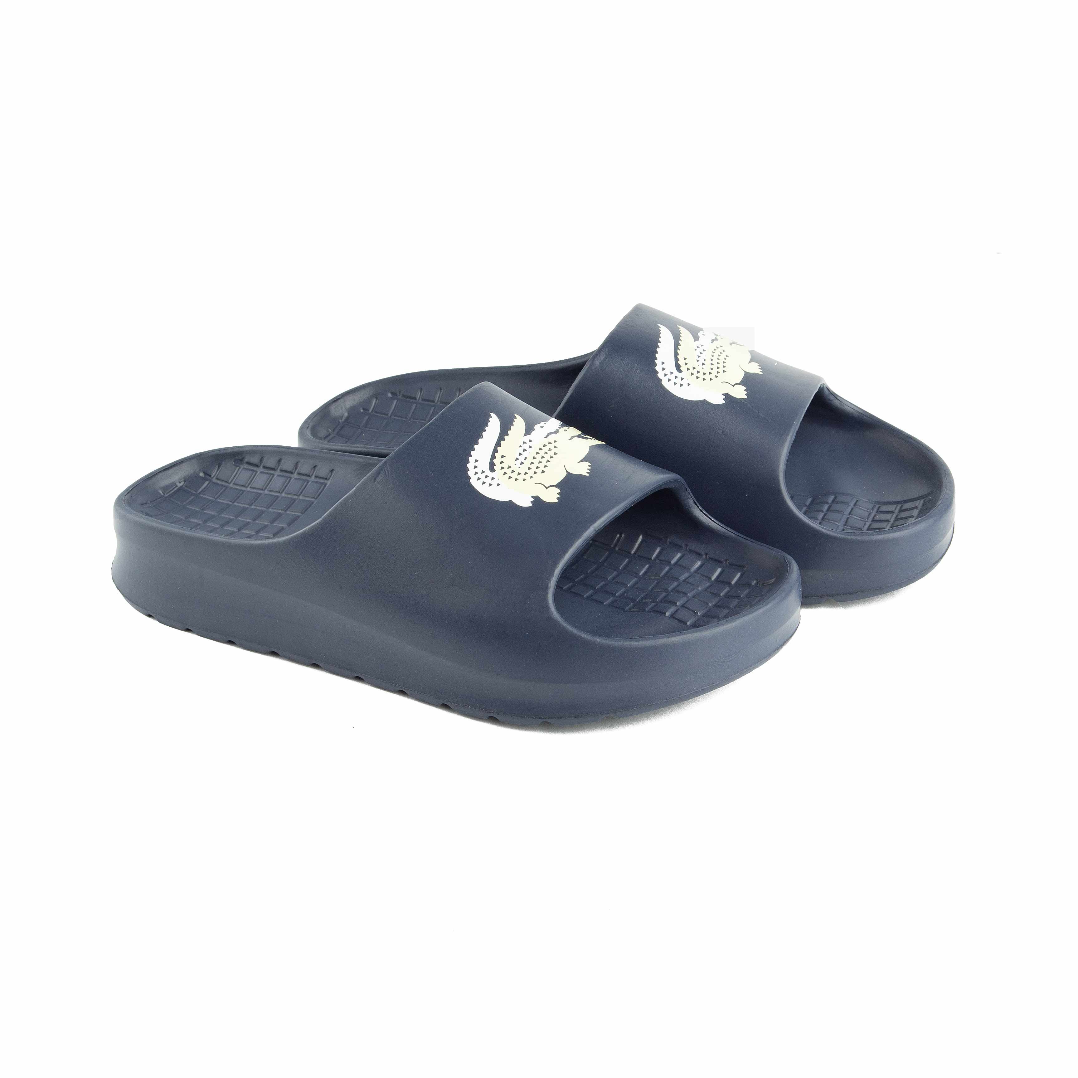 Iconic Lacoste Croc Logo slide sandals in navy blue. Perfect for poolside, beach, or casual comfort. Durable & waterproof for men & women.