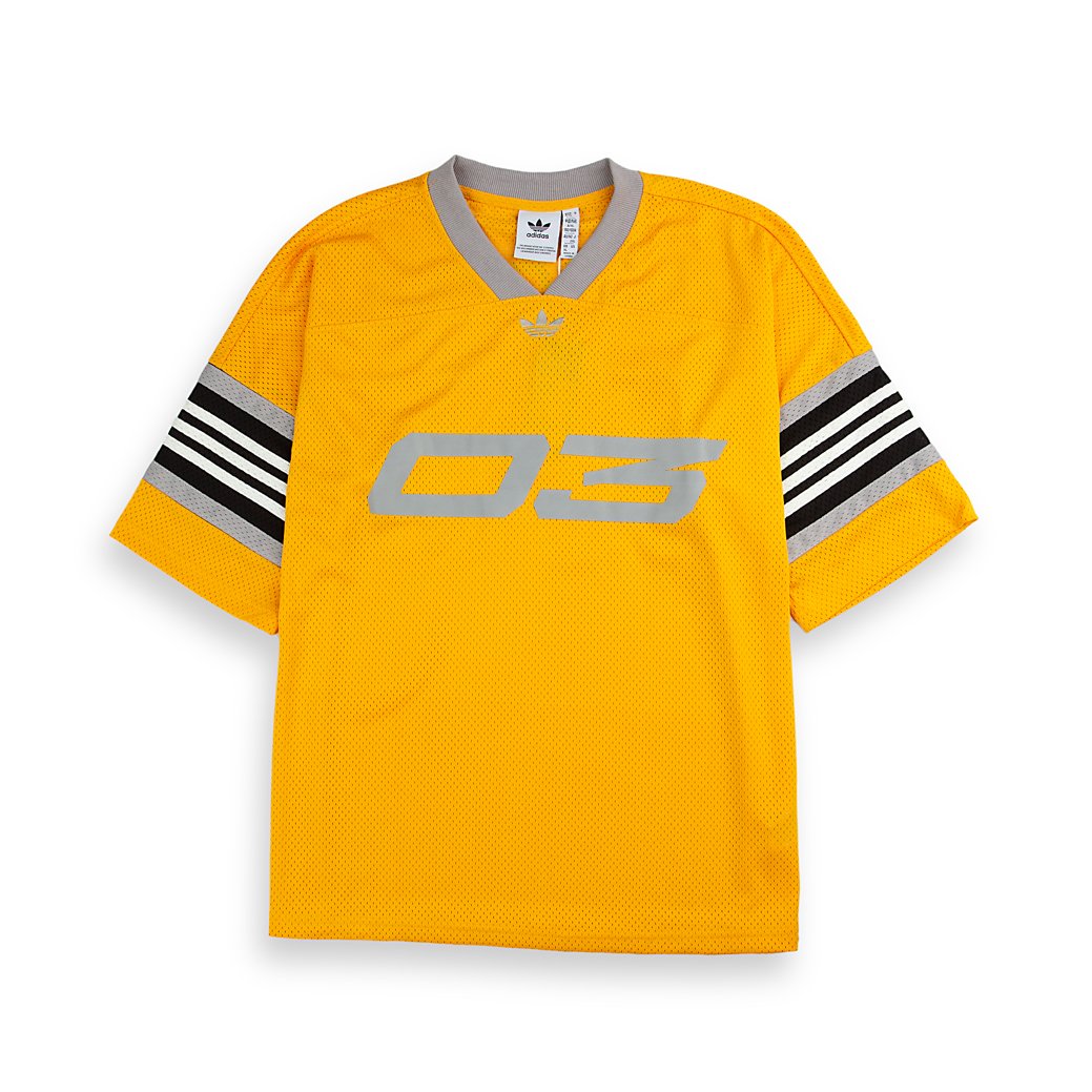 Adidas Originals mesh jersey. This unisex yellow jersey features a large "03" graphic, striped sleeves, and a lightweight feel for a sporty look