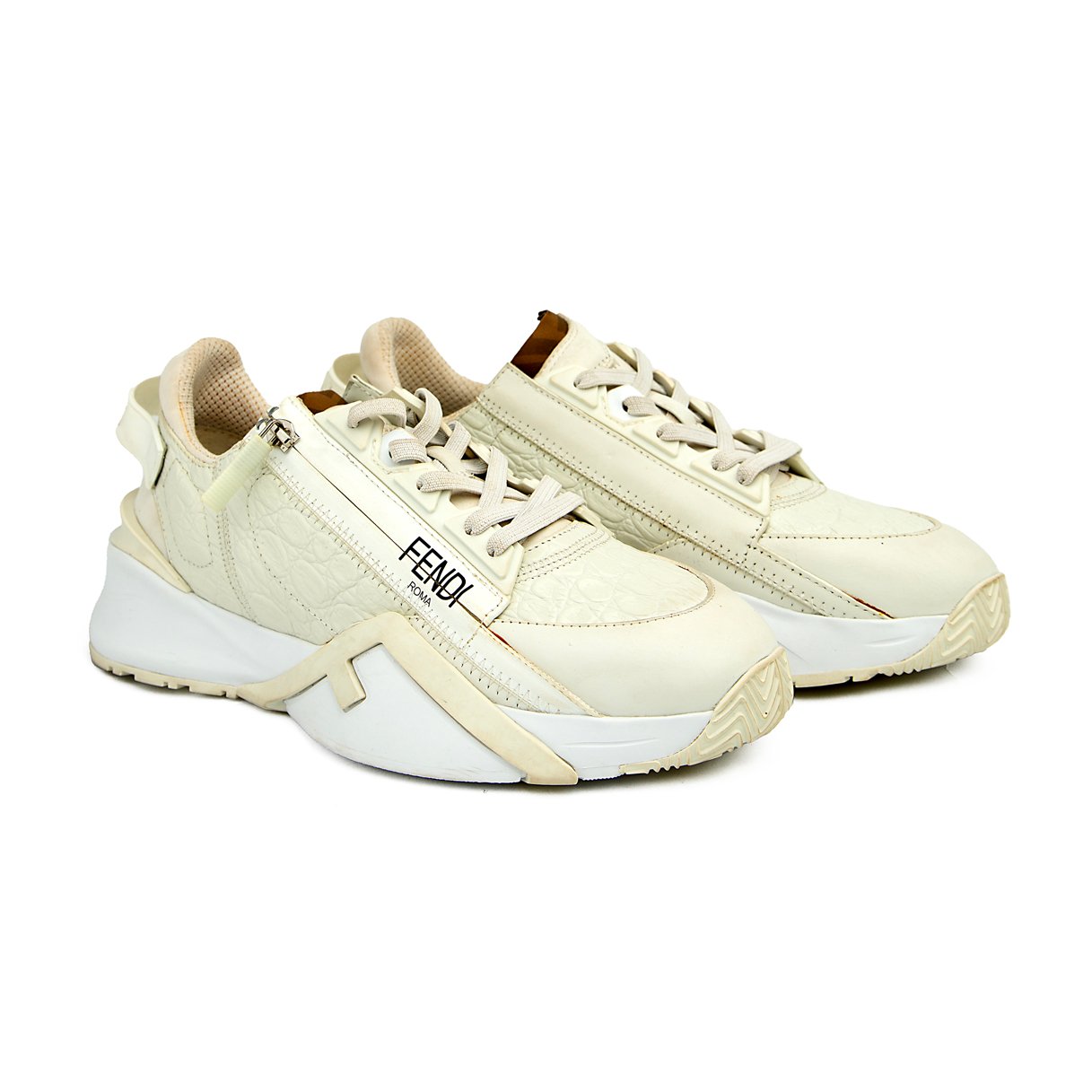 The Ivory Apex Trainer is a luxurious, modern running-inspired sneaker defined by its dramatic, chunky silhouette and premium detailing.