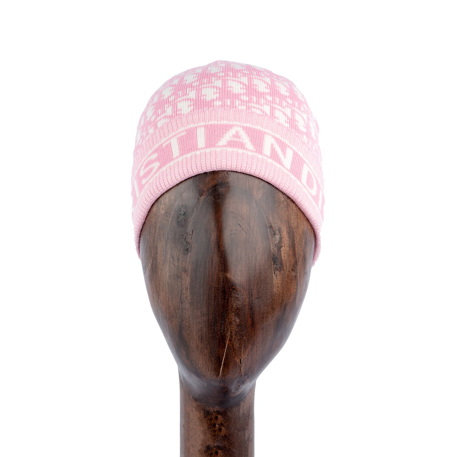 Pink knit beanie with logo and jacquard pattern.