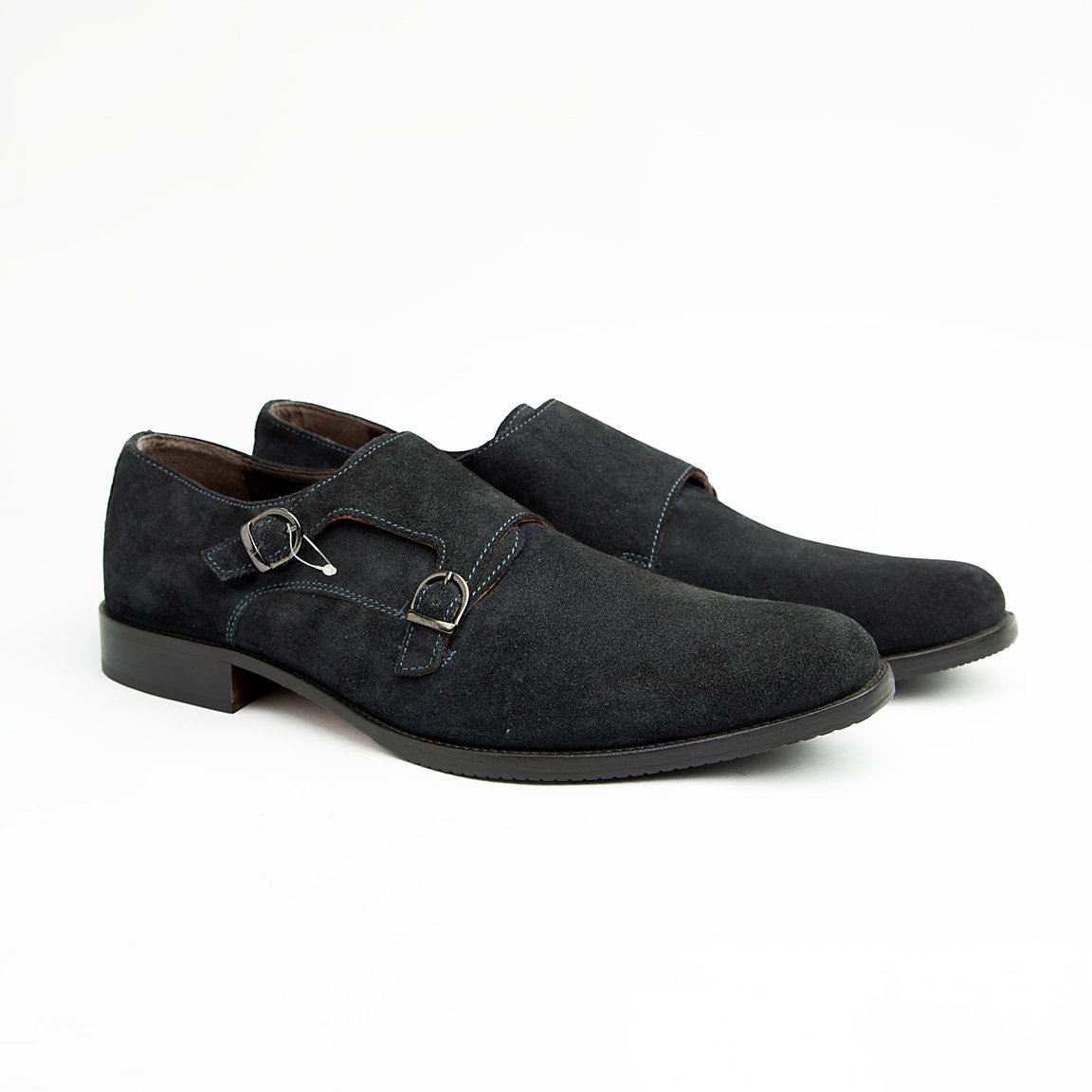 Crafted from luxurious, deep navy blue suede, these sophisticated dress shoes feature the distinguished double monk strap closure with polished silver-tone buckles, offering a timeless and secure fit.
