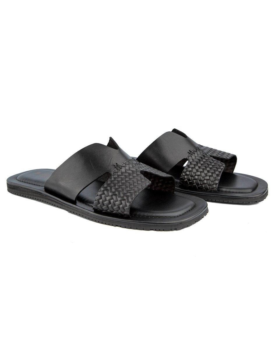 Elegant black woven cross-strap leather sandals with cushioned footbed and durable rubber sole, perfect for casual and semi-formal occasions.