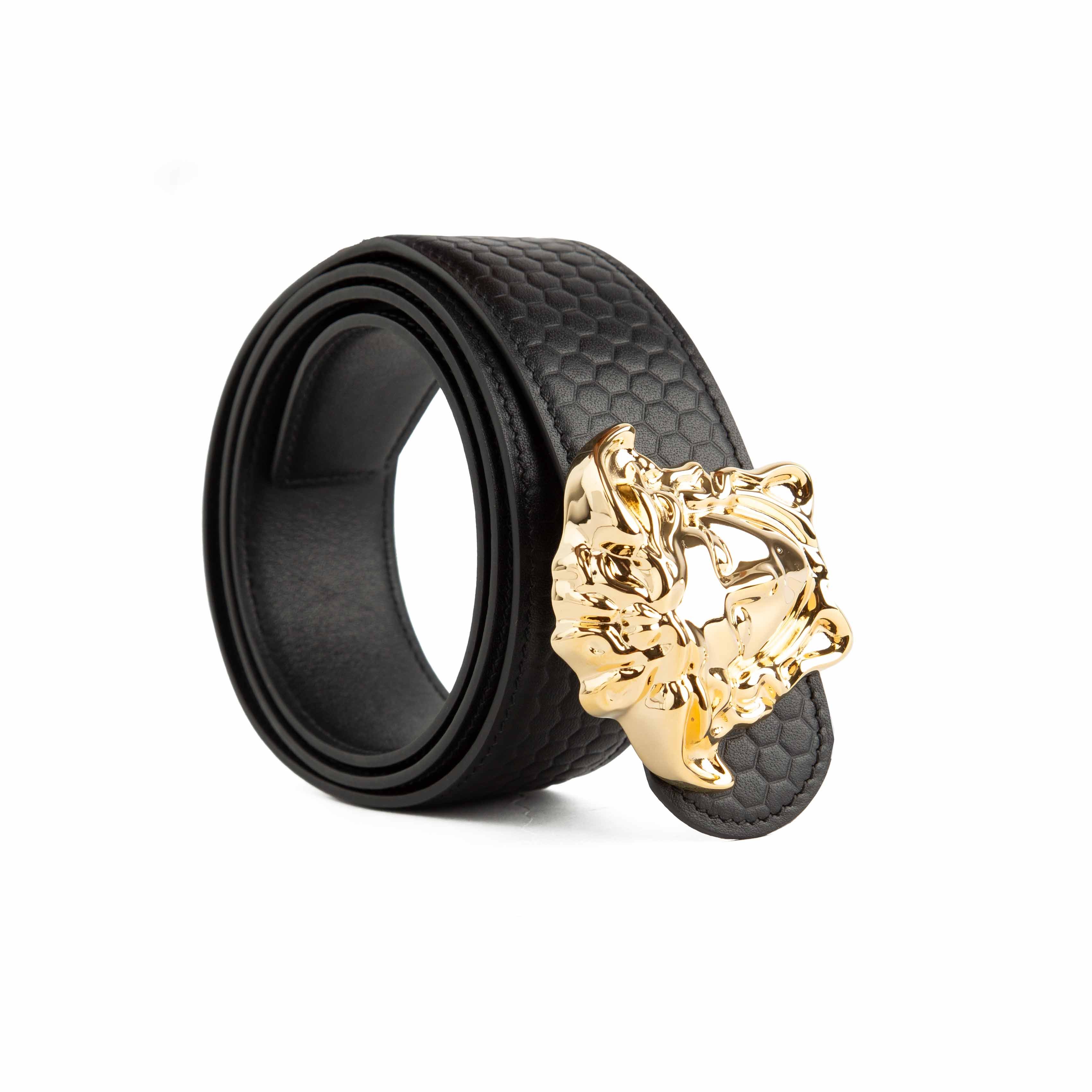 This statement accessory elevates the classic black leather belt through intricate detailing.