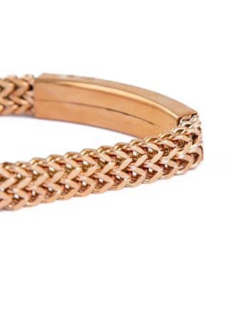 Hublot gold braided metal bracelet with logo plate.