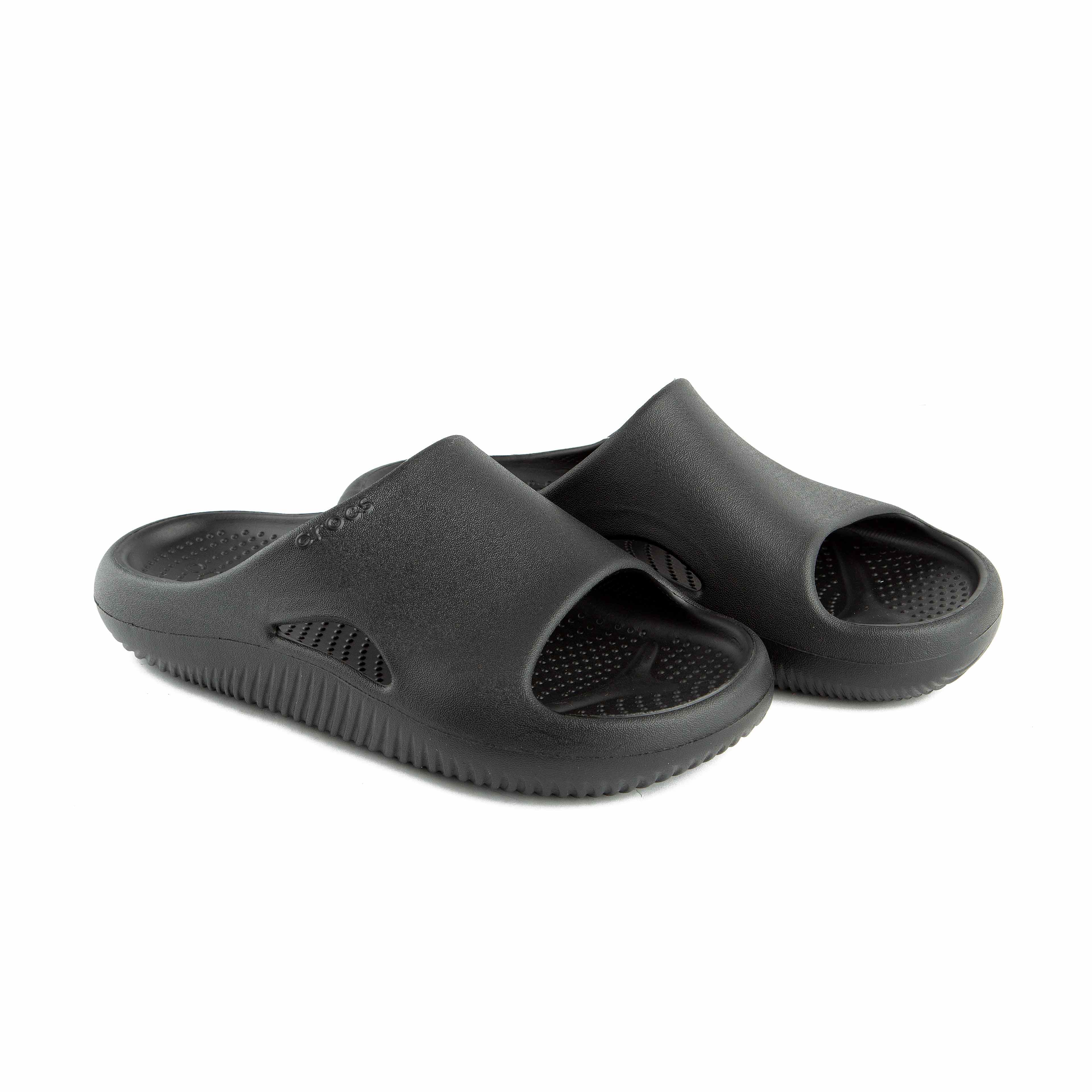 This is a pair of solid black, slip-on slide sandals from the Crocs brand.