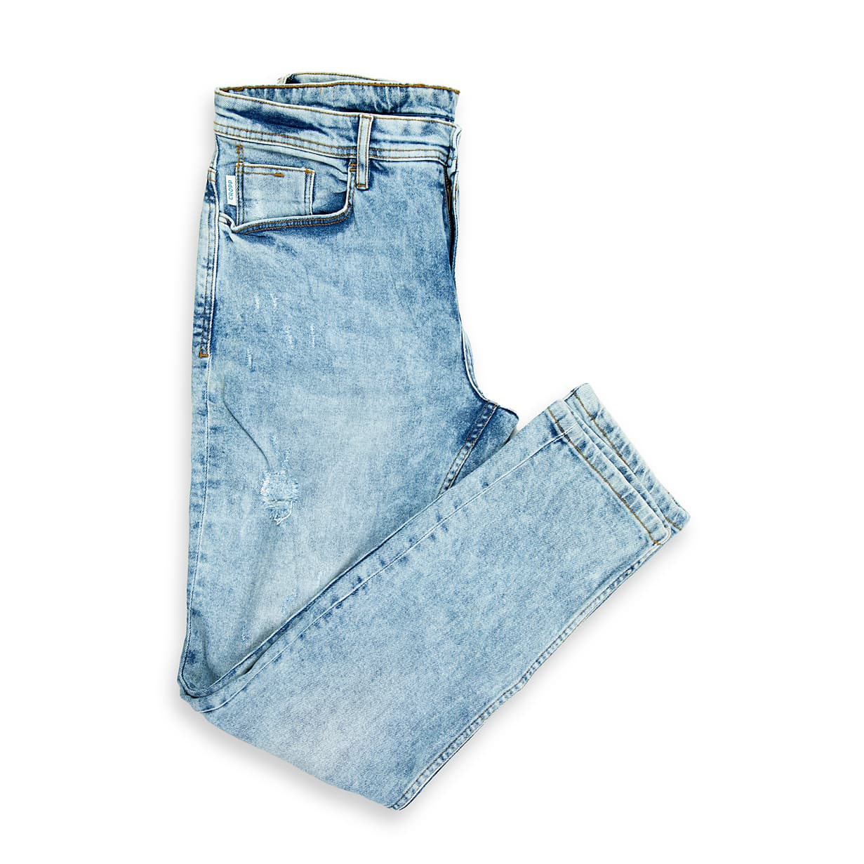 These are a pair of tapered-fit jeans defined by their distinct light acid wash or "snow wash" effect. The fabric has a heavily faded, streaky, and almost marbled appearance, reminiscent of 1980s and 1990s denim trends.