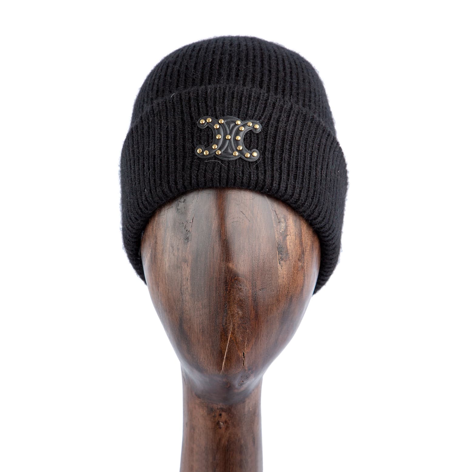 Black luxury knitted beanie with gold-studded logo emblem for men and women, soft and warm winter accessory available on Agu.ng.